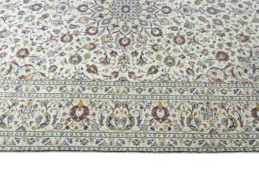 Corner detail of 2000s Kashan rug showing border pattern and Wool pile