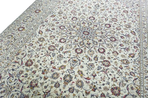 Backside of handmade 2000s Kashan rug showing knot structure and weave density