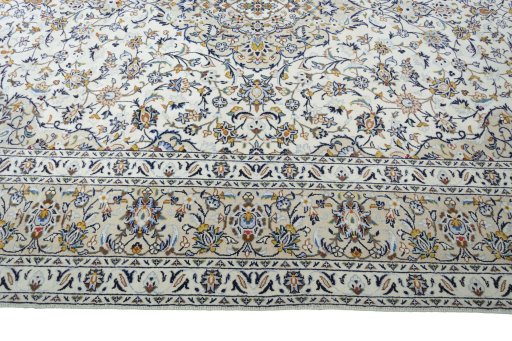 Corner detail of New Kashan rug showing border pattern and Wool pile