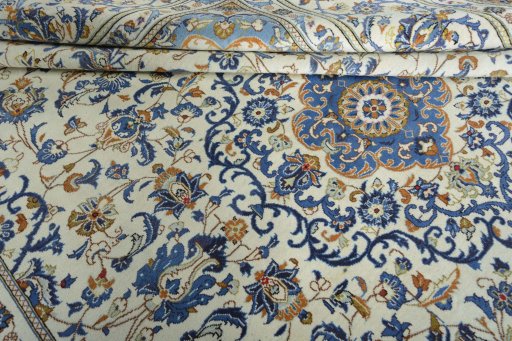 Close-up detail of 2000s Kashan rug from Iran / Persia showing Wool weave