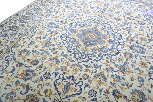 Backside of handmade 2000s Kashan rug showing knot structure and weave density