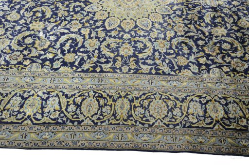 Corner detail of New Kashan rug showing border pattern and Cork pile