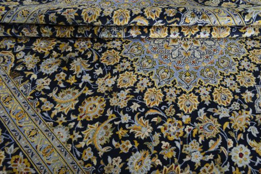 Close-up detail of 2000s Kashan rug from Iran / Persia showing Wool weave