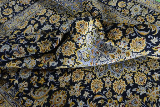 Surface texture of 2000s Kashan rug with natural Wool and intricate pattern