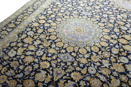 Backside of handmade 2000s Kashan rug showing knot structure and weave density