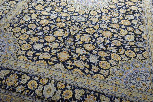 Close-up detail of 2000s Kashan rug from Iran / Persia showing Wool weave