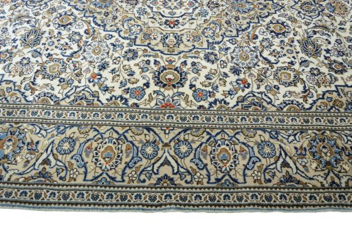 Corner detail of New Kashan rug showing border pattern and Wool pile