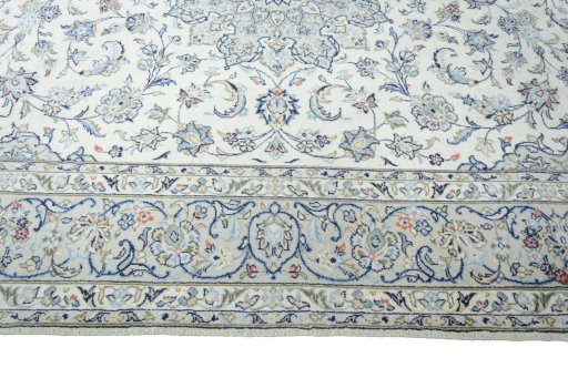 Corner detail of New Kashan rug showing border pattern and Wool pile