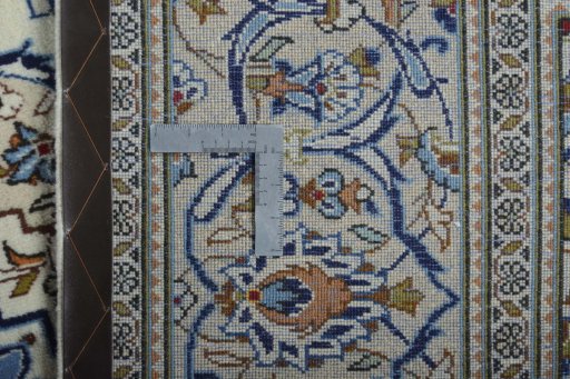 Backside of handmade 2000s Kashan rug showing knot structure and weave density