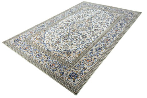 Corner detail of 2000s Kashan rug showing border pattern and Wool pile