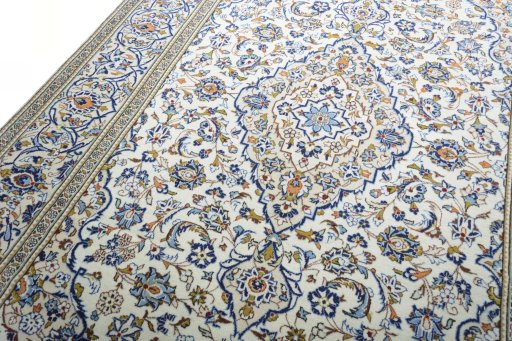 Backside of handmade 2000s Kashan rug showing knot structure and weave density