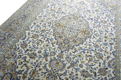 Backside of handmade 2000s Kashan rug showing knot structure and weave density