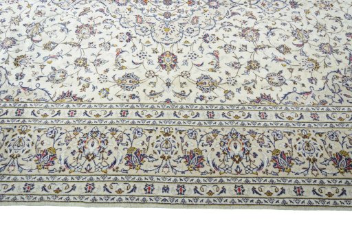 Corner detail of New Kashan rug showing border pattern and Wool pile