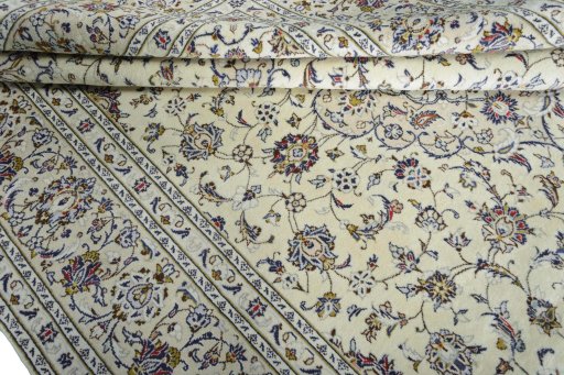 Close-up detail of New Kashan rug from Iran / Persia showing Wool weave