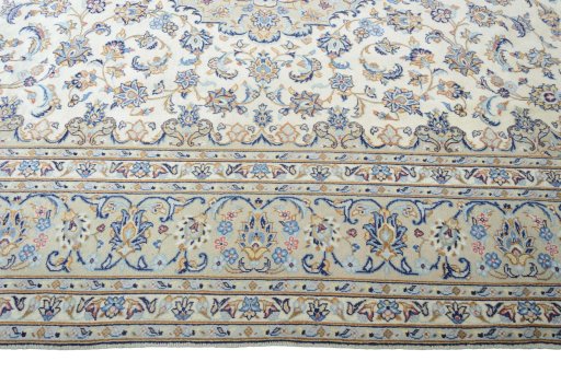 Corner detail of New Kashan rug showing border pattern and Wool pile