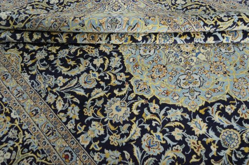 Close-up detail of 2000s Kashan rug from Iran / Persia showing Wool weave