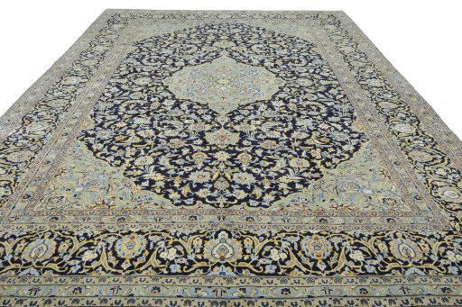 Surface texture of 2000s Kashan rug with natural Wool and intricate pattern