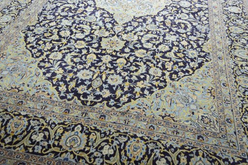Close-up detail of 2000s Kashan rug from Iran / Persia showing Wool weave