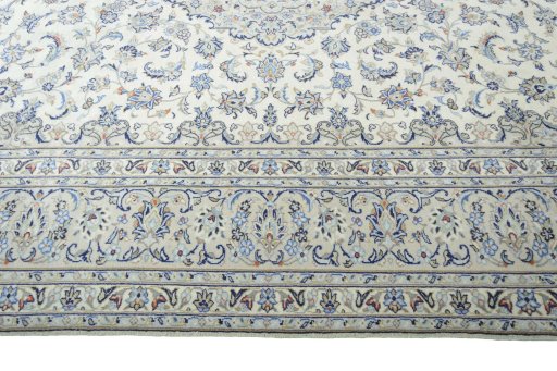 Corner detail of New Kashan rug showing border pattern and Wool pile