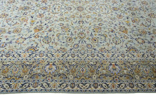 Corner detail of 2000s Kashan rug showing border pattern and Wool pile