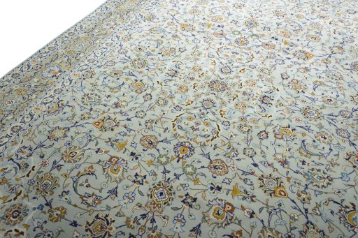 Backside of handmade 2000s Kashan rug showing knot structure and weave density