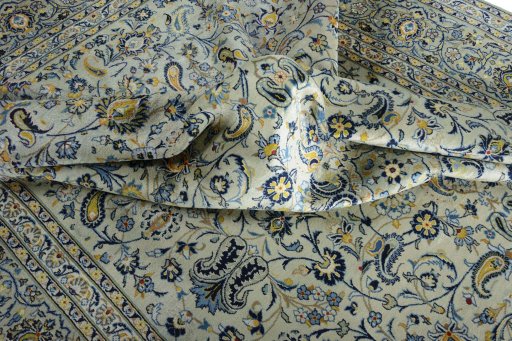 Surface texture of 2000s Kashan rug with natural Wool and intricate pattern