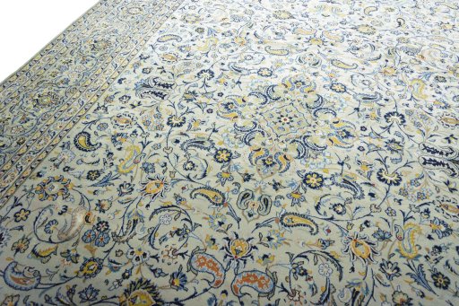 Backside of handmade 2000s Kashan rug showing knot structure and weave density