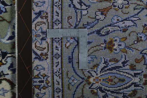Backside of handmade 2000s Kashan rug showing knot structure and weave density