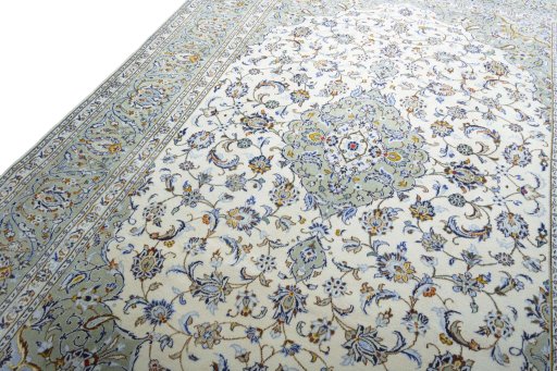 Backside of handmade 2000s Kashan rug showing knot structure and weave density