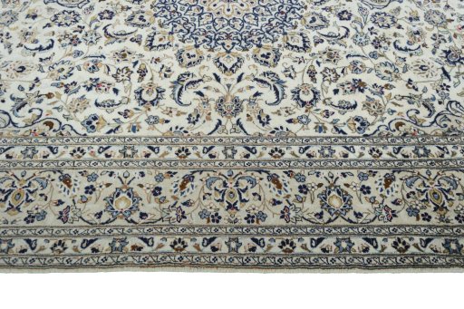 Corner detail of New Kashan rug showing border pattern and Wool pile