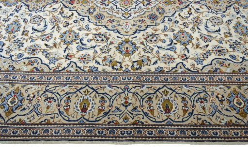 Corner detail of New Kashan rug showing border pattern and Wool pile