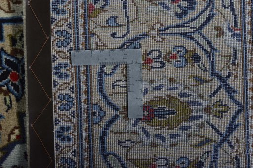 Backside of handmade New Kashan rug showing knot structure and weave density
