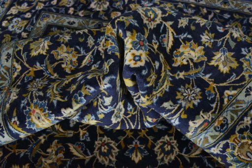 Surface texture of 2000s Kashan rug with natural Wool and intricate pattern