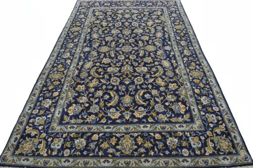 Surface texture of 2000s Kashan rug with natural Wool and intricate pattern