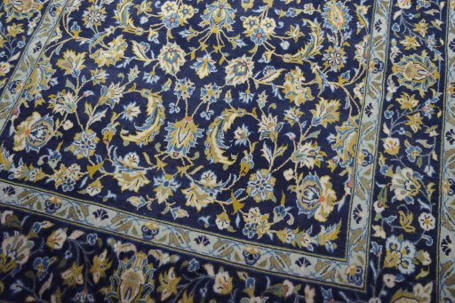 Close-up detail of 2000s Kashan rug from Iran / Persia showing Wool weave