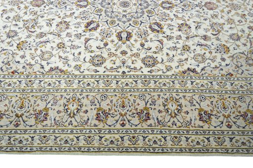 Corner detail of New Kashan rug showing border pattern and Wool pile