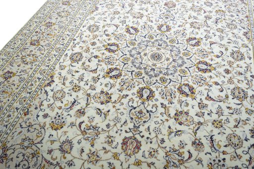 Backside of handmade New Kashan rug showing knot structure and weave density