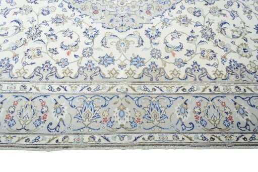 Corner detail of 2000s Kashan rug showing border pattern and Wool pile