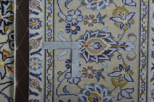 Backside of handmade 2000s Kashan rug showing knot structure and weave density