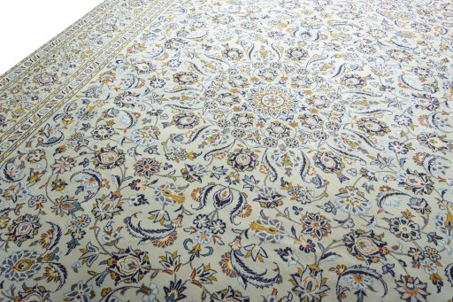 Backside of handmade 2000s Kashan rug showing knot structure and weave density