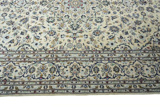 Corner detail of New Kashan rug showing border pattern and Wool pile