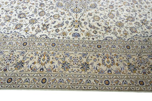Corner detail of New Kashan rug showing border pattern and Wool pile