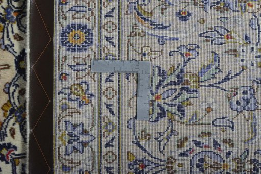 Backside of handmade New Kashan rug showing knot structure and weave density