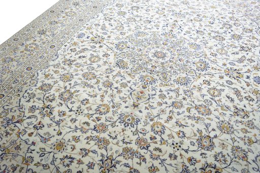 Backside of handmade New Kashan rug showing knot structure and weave density