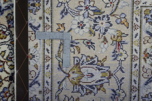 Backside of handmade 2000s Kashan rug showing knot structure and weave density