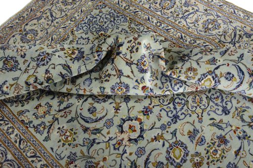 Surface texture of 2000s Kashan rug with natural Wool and intricate pattern