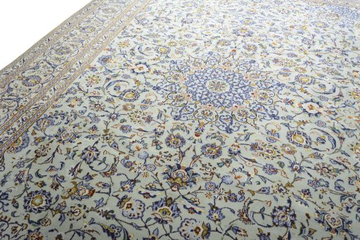 Backside of handmade 2000s Kashan rug showing knot structure and weave density