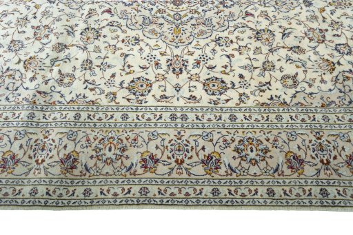 Corner detail of New Kashan rug showing border pattern and Wool pile