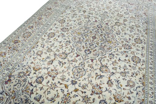Backside of handmade New Kashan rug showing knot structure and weave density