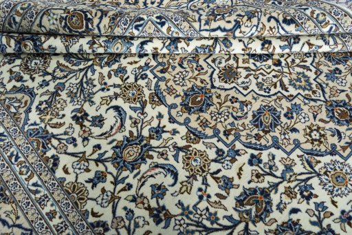 Close-up detail of 2000s Kashan rug from Iran / Persia showing Wool weave